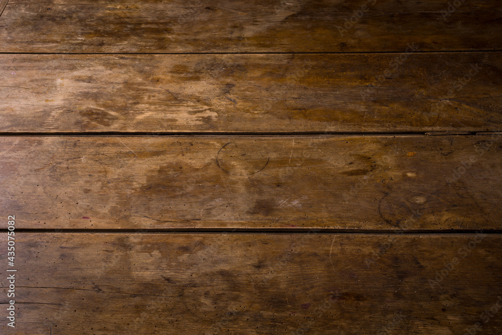 Naklejka premium old wooden table top background with wear marks