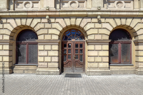 Facade of the building of the stock exchange in Kaliningrad. Arched window and doorways