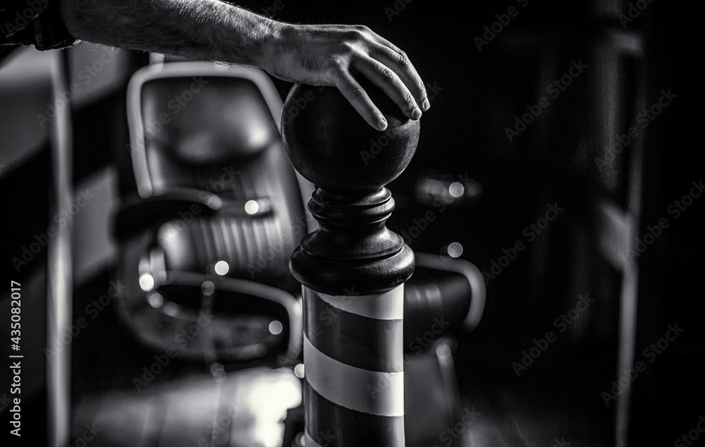 Barber shop chair. Barbershop armchair, salon, barber shop for men. Barber shop pole. Logo of the barbershop. Stylish vintage barber chair. Hairstylist in barbershop interior. Black and white Barber shop chair. Barbershop armchair, salon, barber shop for men. Barber shop pole. Logo of the barbershop. Stylish vintage barber chair. Hairstylist in barbershop interior. Black and white