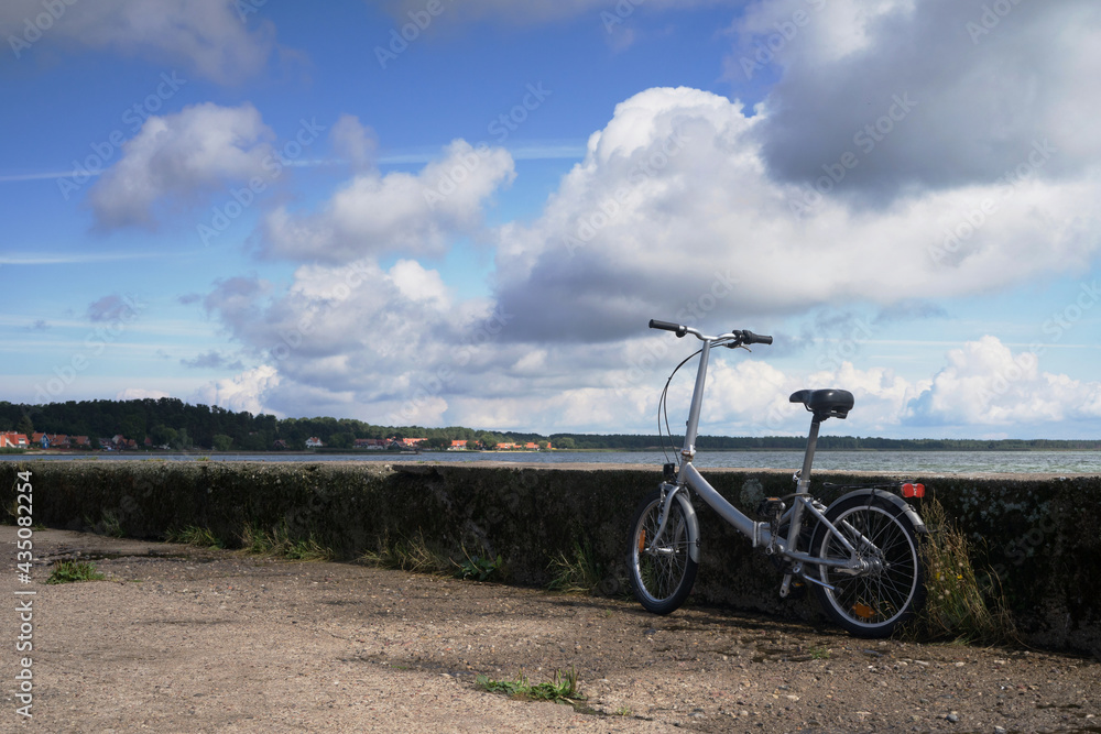 Fototapeta premium bike near a water an a moody day