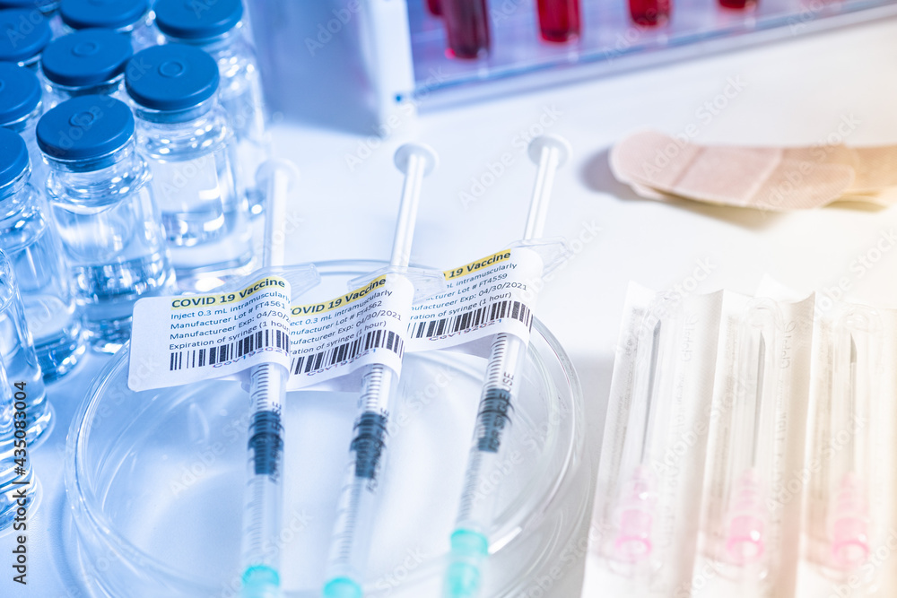 COVID19 vaccine and syringe. Vials and ampoules with coronavirus