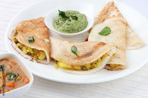 masala dosa with coconut chutney and mint chutney.
South Indian food.
