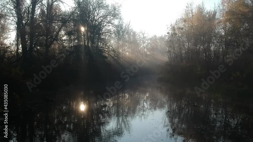 Morning fog over a small river - flight over water on a drone