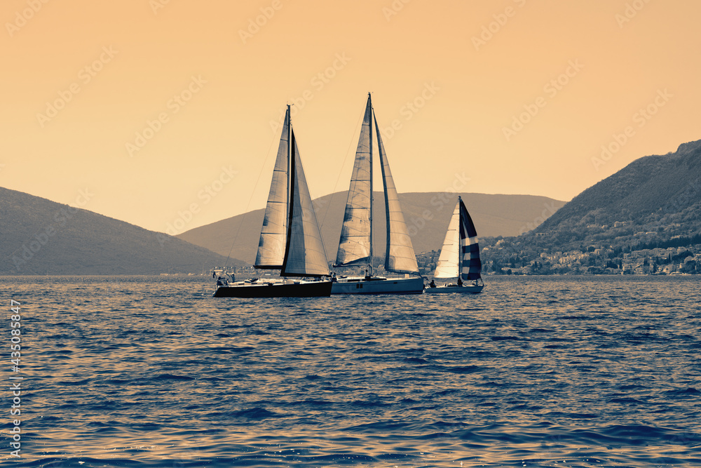 Sailing boats on the water. Mediterranean landscape. Montenegro. Color toning