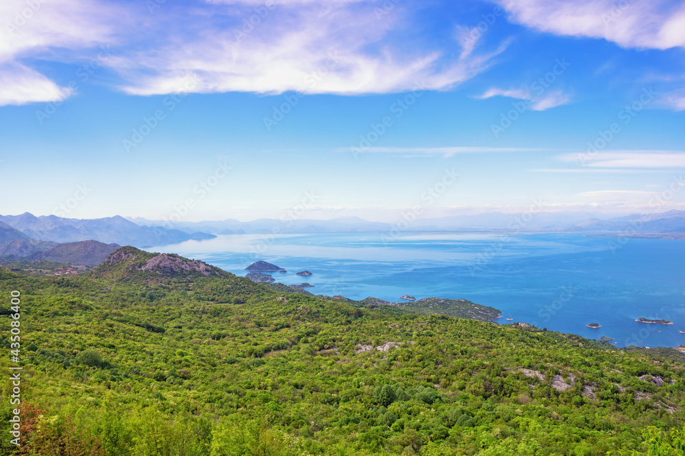 Beautiful Mediterranean landscape with lake on sunny spring day. National Park Lake Skadar, Montenegro