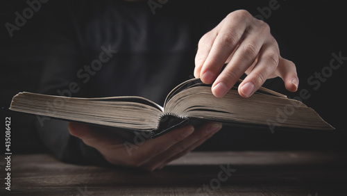 Caucasian man holding bible. Religion
