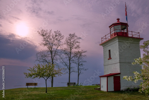 The sun sets over Lake Huron as seen from the historic Goderich Lighthouse. photo