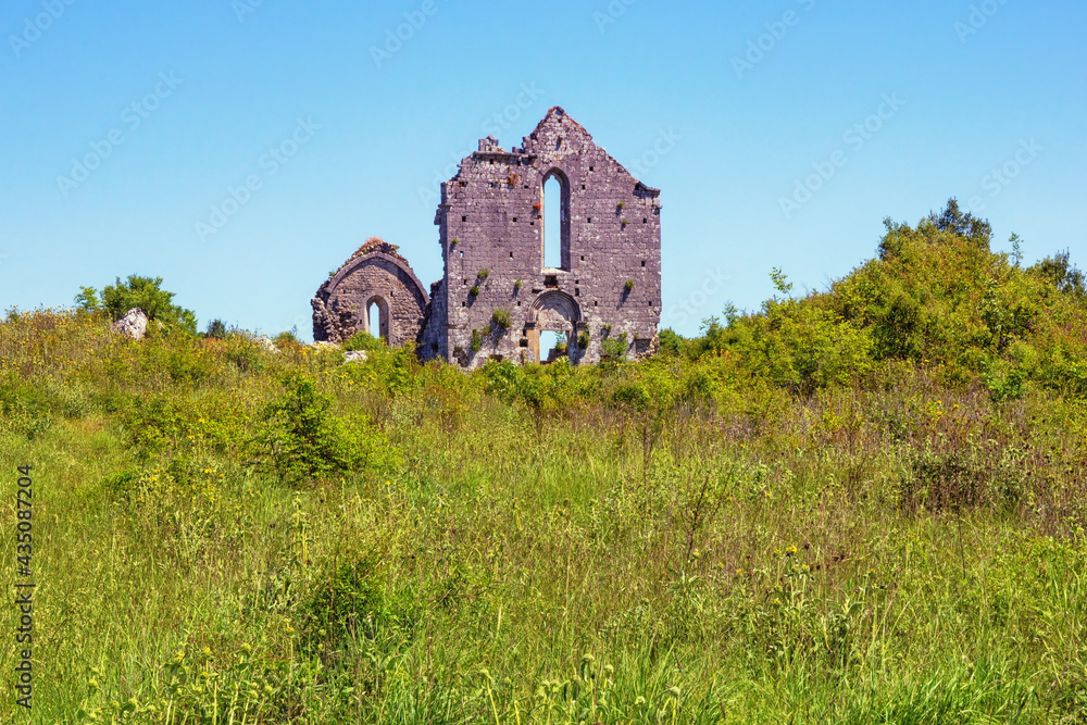 Ruins of ancient church. Montenegro, Ulcinj. Meadow near Old Town Shas Ruins of ancient church. Montenegro, Ulcinj. Meadow near Old Town Shas