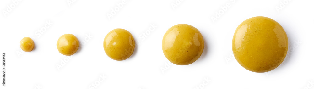 Drops of mustard isolated on white, from above