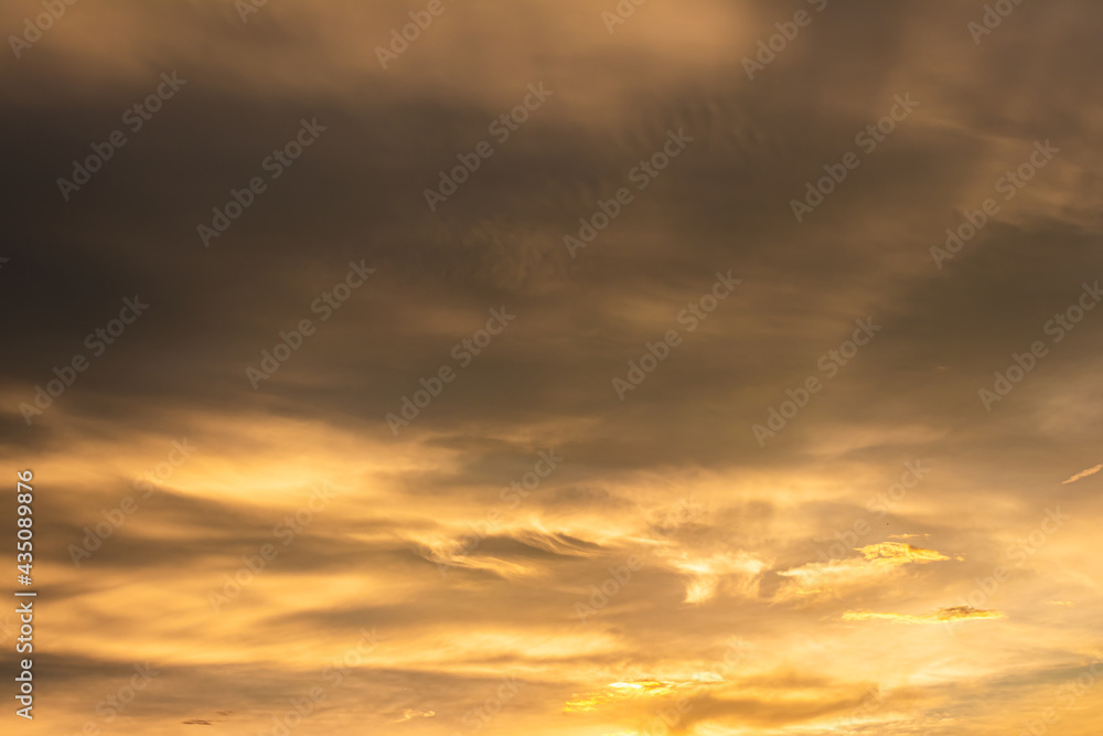 glow dramatic colorful rain cloud sky sunset with twilight color golden sky and clouds. Gradient color. Sky texture abstract nature background.