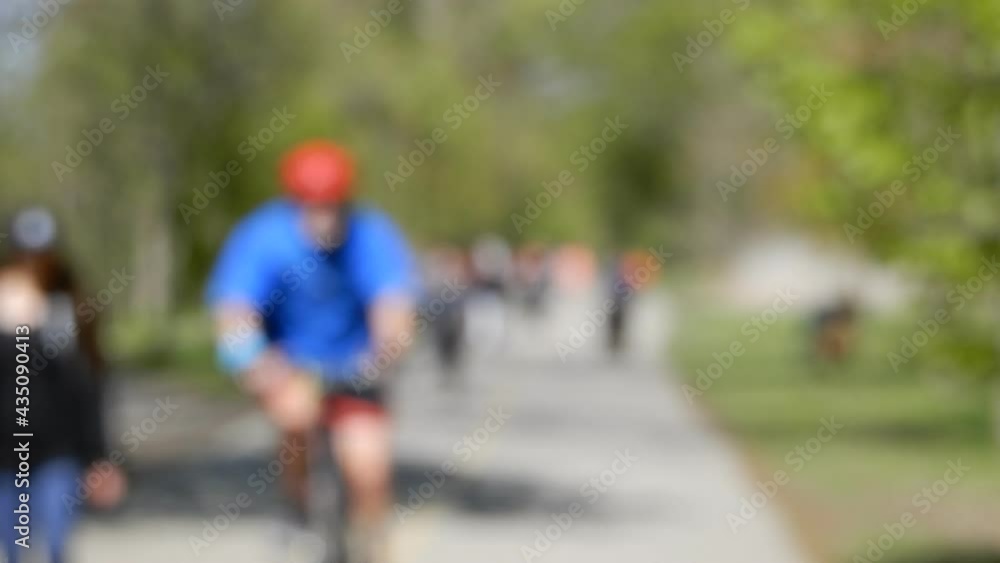 Cyclists And Other Pedestrians Enjoying Summer Day Cyclists And Other Pedestrians Enjoying Summer Day