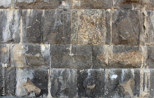 Murais de parede Textured dirty dolomite surface of river embankment