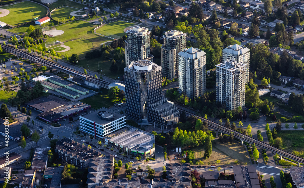 Obraz premium Aerial View from an Airplane of Residential Homes and Buildings near Surrey Central Mall. Greater Vancouver, British Columbia, Canada.