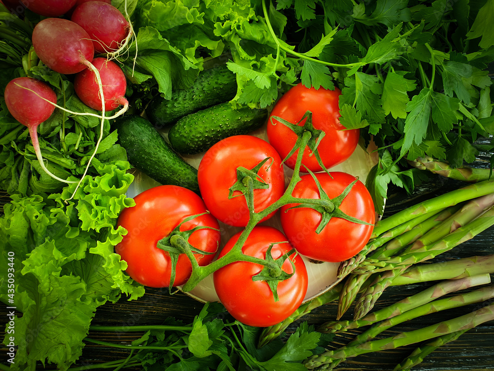 fresh organic vegetables on a wooden background fresh organic vegetables on a wooden background