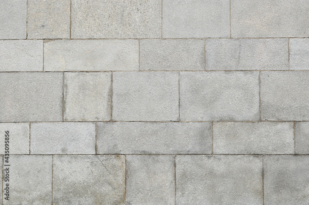 Background, texture, design. A wall of large gray stone blocks. Background, texture, design. A wall of large gray stone blocks.