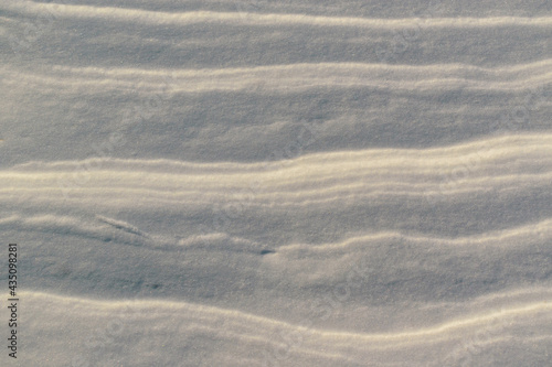 Compacted layers of snow. Shine. Layered background concept.