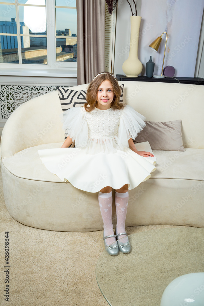 Brown haired girl wearing white dress white knee socks and silver