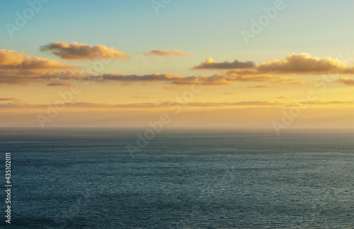 Bright sunset over the sea. Skyline with clouds. © Oleksiy