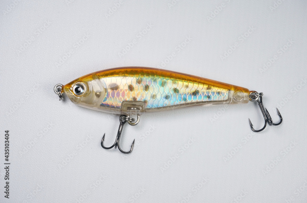 Plastic fishing lure on a white background. Home made fishing lure. Plastic fishing lure on a white background. Home made fishing lure.