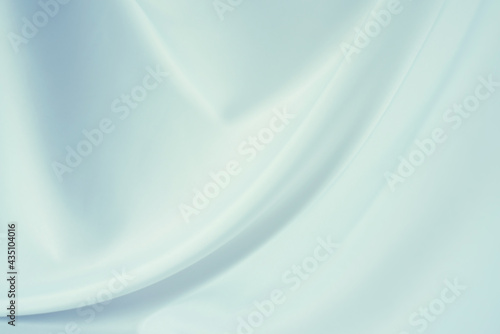 Elegant light blue silk or satin texture can use as abstract background. Luxurious background design