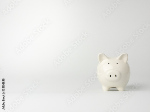 Piggy bank in pink background minimal style, Business, finance, investment, saving and corruption concept.	
