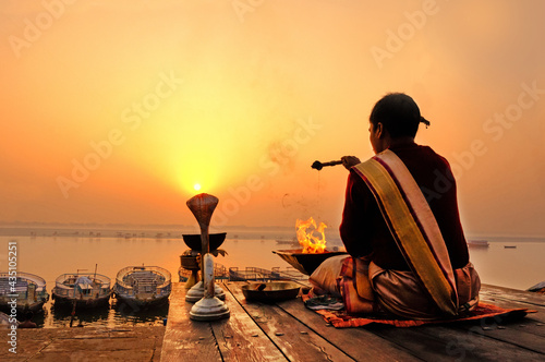 An Unidentified Hindu Brahman monk meditates on the ghat stairs of holy Ganges river