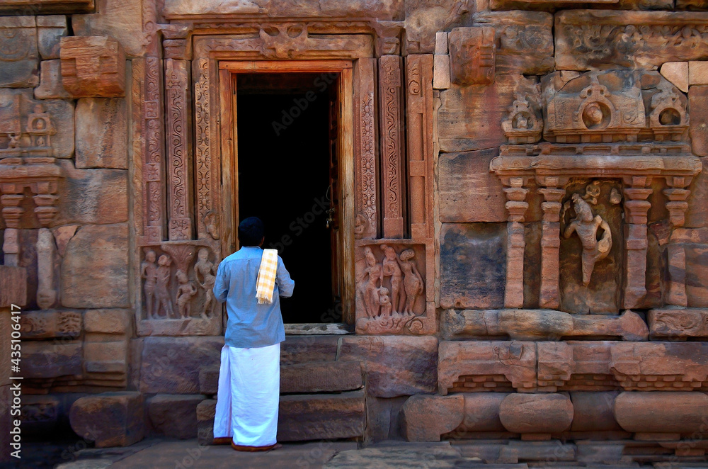 Hampi, Karnataka, India - January 25 2020: An Indian man prays at a Temple at Hampi, Karnataka, India
