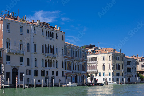 facades facing blue clean waters of busy grand canal of Venice © Alevtina