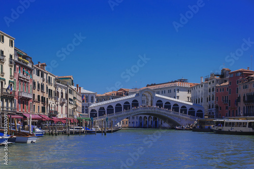gondola passing under Venice bridge Ponte di Realto