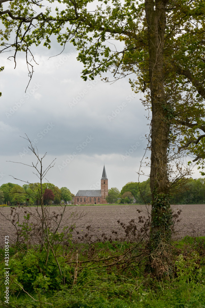 The Jacobskerk in the Dutch village Rolde, a gothic church on the edge of the village, bordering a field