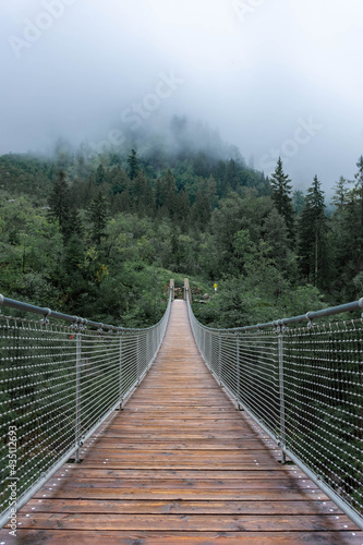 The Hangebrucke, hanging wooden bridge in the forest of Berchtesgaden National Park, Germany