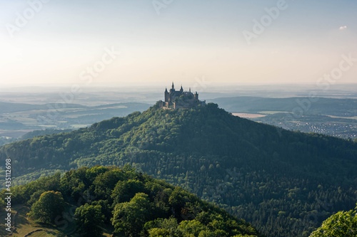 Aerial view of famous Hohenzollern Castle, ancestral seat of the imperial House of Hohenzollern and one of Europe's most visited castles, on the top of a green hill in Baden-Wurttemberg, Germany