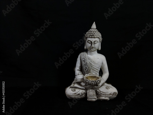 figura de buda joven en estado de meditación photo