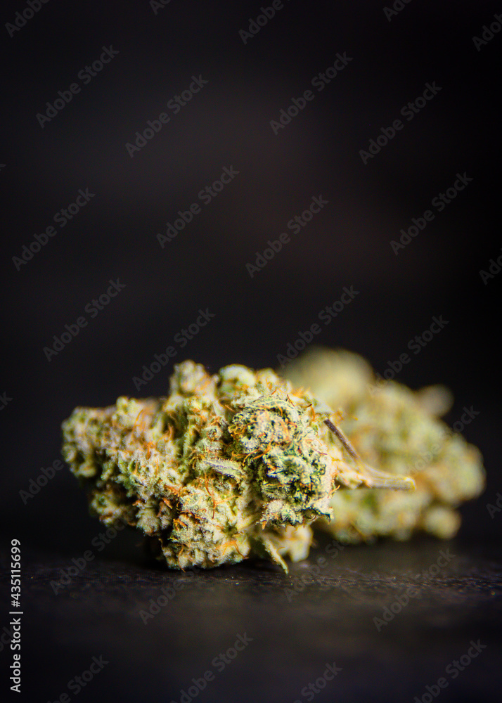 close up of marijuana bud black background