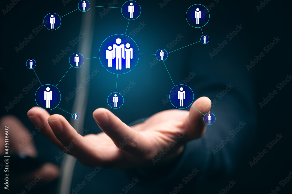 Fototapeta premium man holding phone with people icon