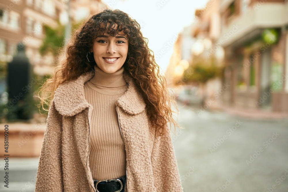 Young hispanic woman smiling happy standing at the city Young hispanic woman smiling happy standing at the city