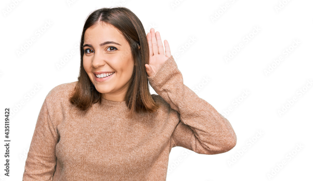 Young beautiful woman wearing casual clothes smiling with hand over ear listening an hearing to rumor or gossip. deafness concept.