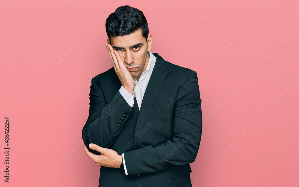 Handsome hispanic man wearing business clothes thinking looking tired and bored with depression problems with crossed arms. Handsome hispanic man wearing business clothes thinking looking tired and bored with depression problems with crossed arms.