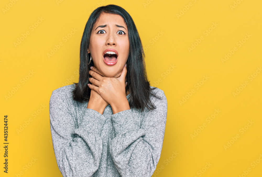 Beautiful asian young woman wearing casual clothes shouting and suffocate because painful strangle. health problem. asphyxiate and suicide concept. Beautiful asian young woman wearing casual clothes shouting and suffocate because painful strangle. health problem. asphyxiate and suicide concept.