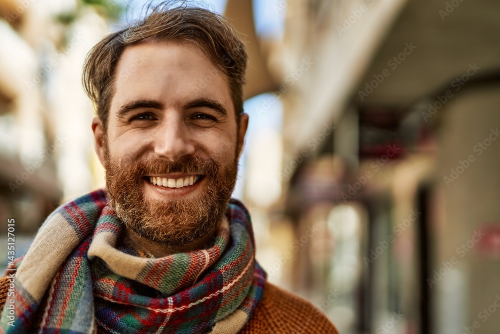 Young caucasian man with beard outdoors on a sunny day - obrazy, fototapety, plakaty 