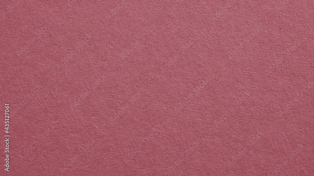 Fototapeta premium The surface of dark red cardboard. Puce paperboard wallpaper. Paper texture with cellulose fibers. Purple-brown tinted background. Beautiful textured backdrop. Top-down. Macro