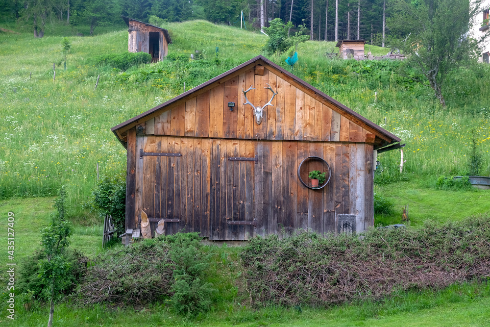 Obraz premium Cute wooden house in northern italy