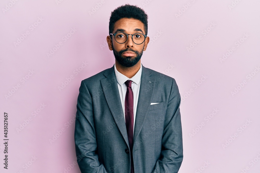 Handsome hispanic business man with beard wearing business suit and tie depressed and worry for distress, crying angry and afraid. sad expression. Handsome hispanic business man with beard wearing business suit and tie depressed and worry for distress, crying angry and afraid. sad expression.