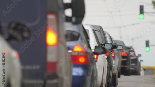 Vehicles on road city freeway. Transport movement. Motorway. Congestion crowded. Busy city moving cars at green traffic light. Vehicles city traffic jam rush highway. City road traffic cars commuting