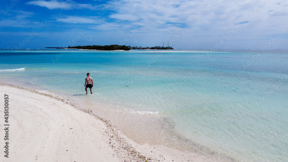 Maldives resort island drone aerial view, Indian ocean atoll nature beach and palm forest, leisure tourist luxury vacation