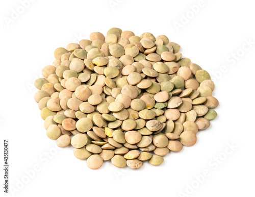 pile of whole light green lentils closeup on white