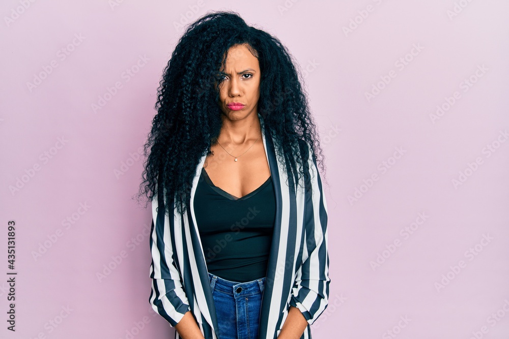 Middle age african american woman wearing casual clothes depressed and worry for distress, crying angry and afraid. sad expression. Middle age african american woman wearing casual clothes depressed and worry for distress, crying angry and afraid. sad expression.