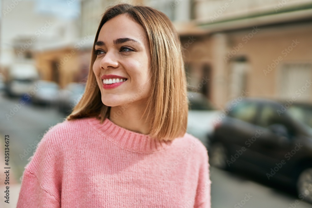 Young caucasian girl smiling happy standing at the city. Young caucasian girl smiling happy standing at the city.
