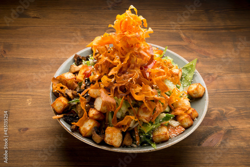 Fresh greens,sherry tomatoes, sprouts, cucumbers, carrot, topped with stir fried mushrooms'Halumi cheese' and sesame and garnished with sweet potato chips and citrus vinaigrette.