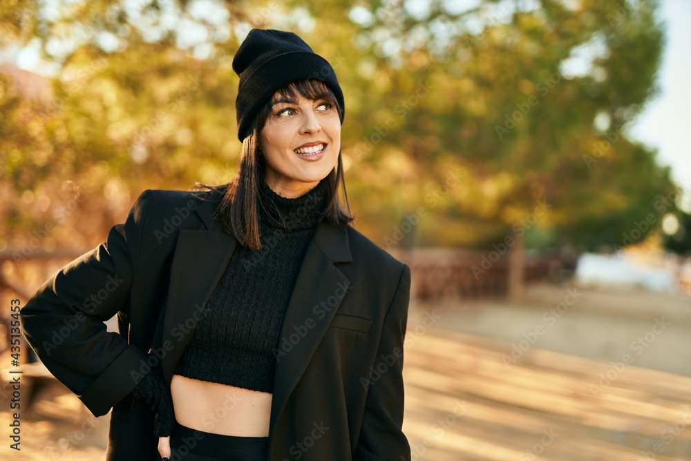 Young hispanic woman smiling happy standing at the city. Young hispanic woman smiling happy standing at the city.